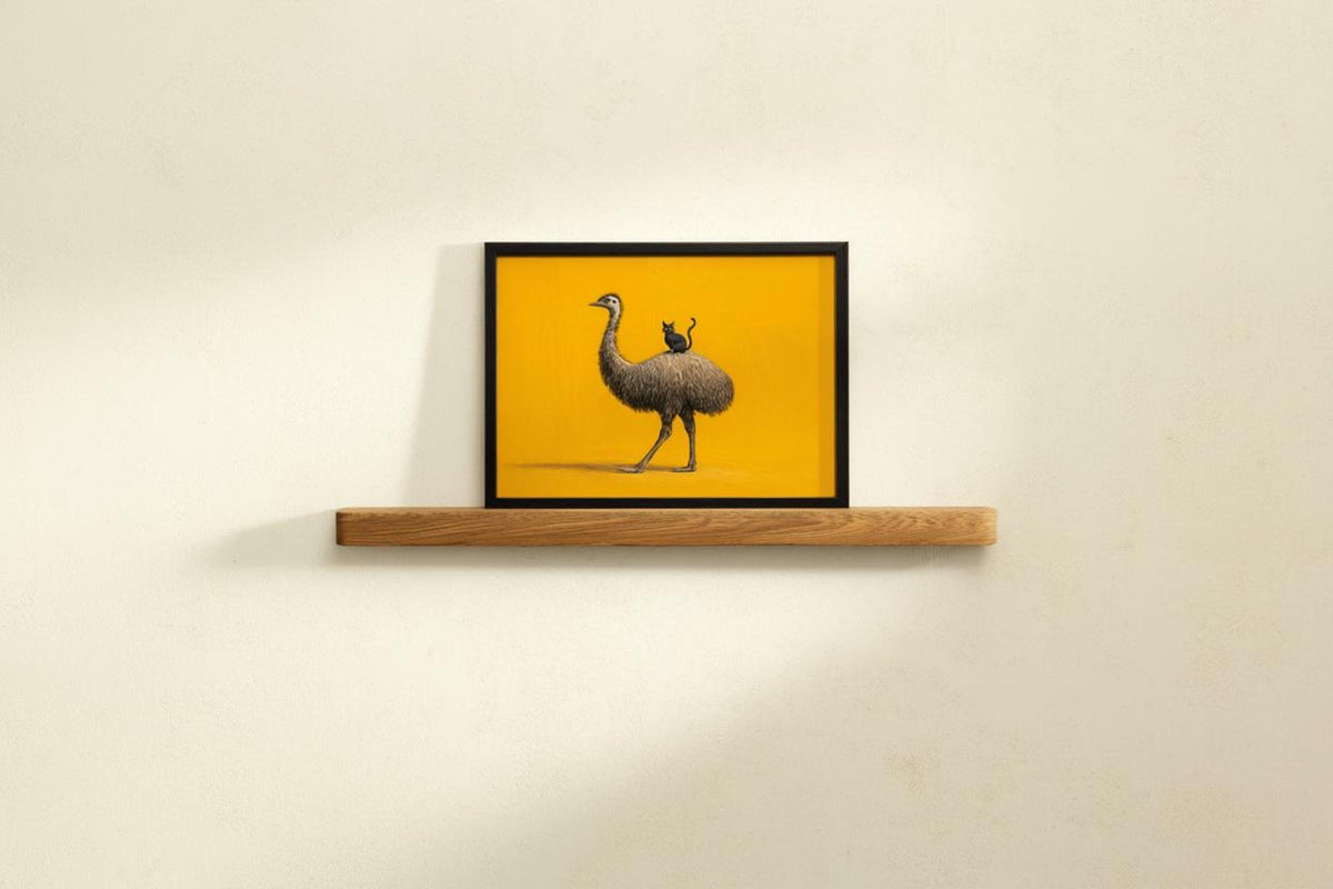 Small framed funny emu wall art on narrow floating shelf, clean composition, mustard-yellow background