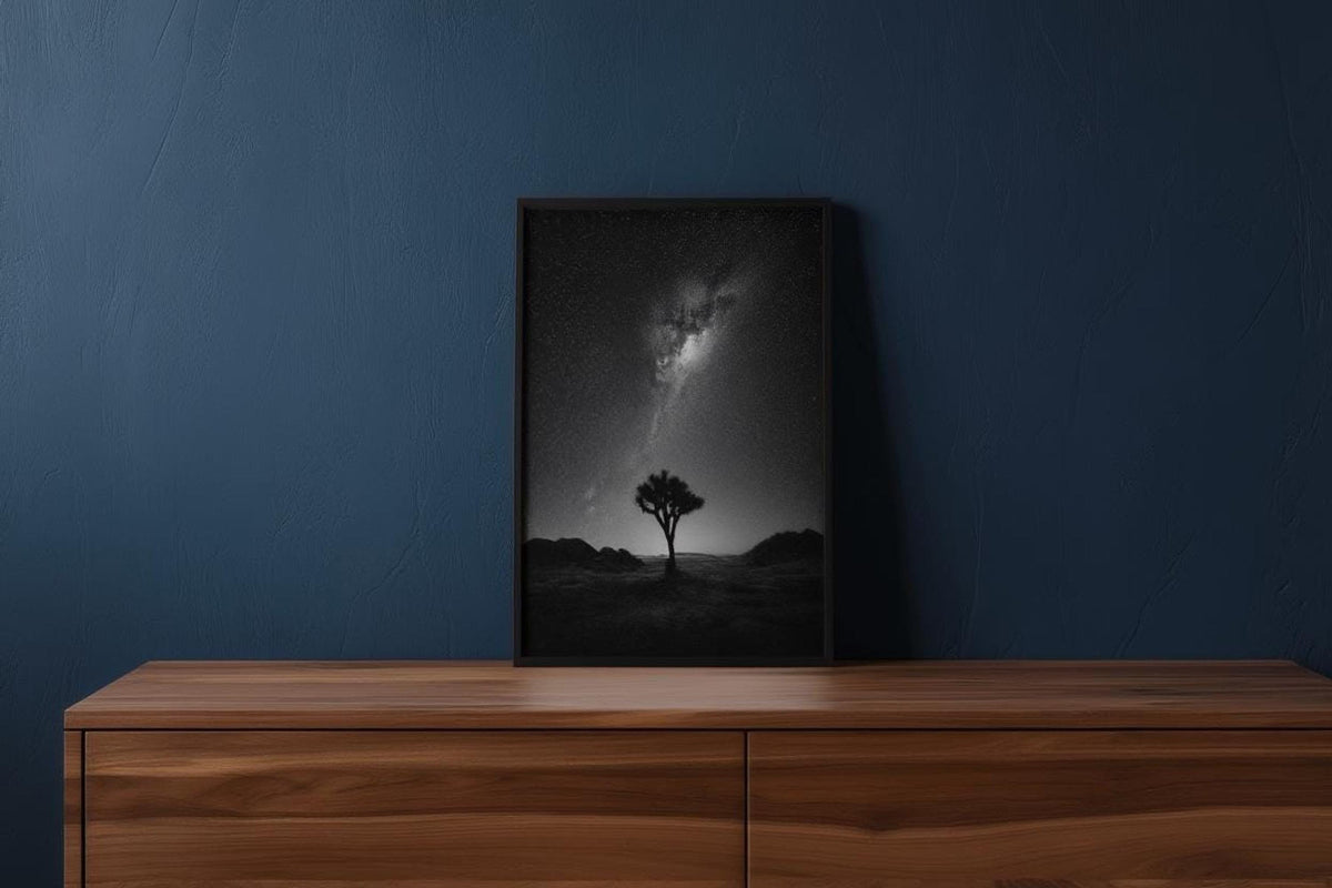 Tall framed joshua tree digital download mockup on a navy wall, placed on a mid-century wooden credenza