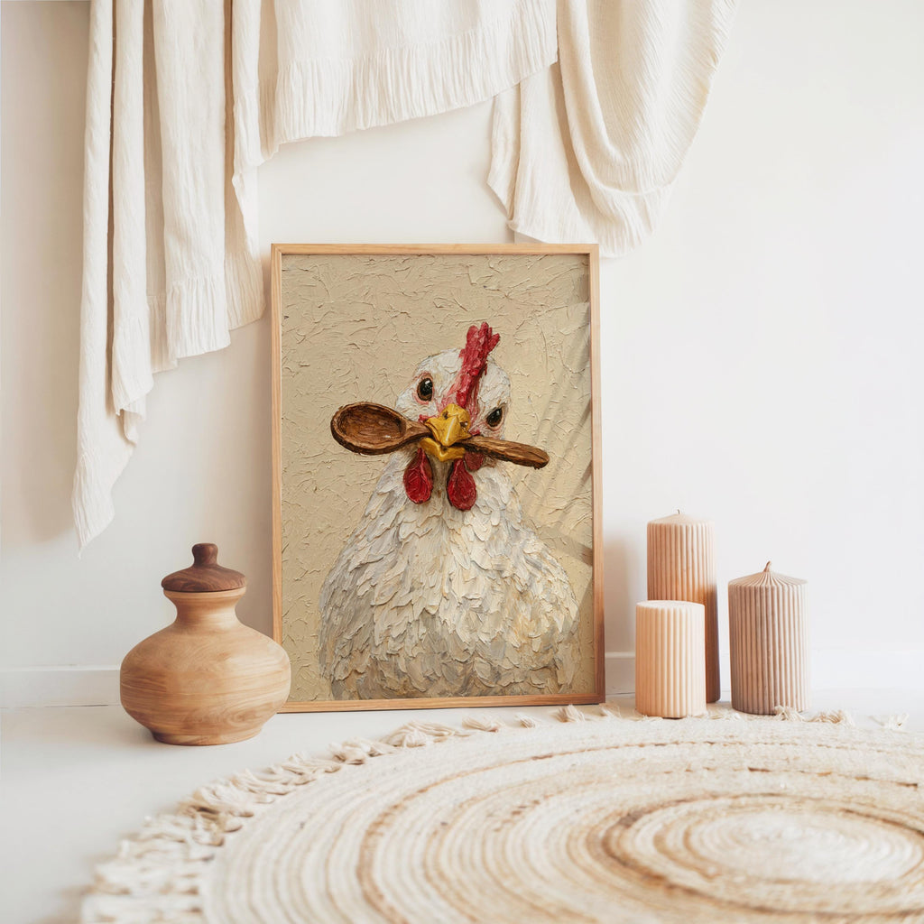 Boho vignette with framed hen holding spoon print on floor, woven rug and pottery, chicken kitchen wall art