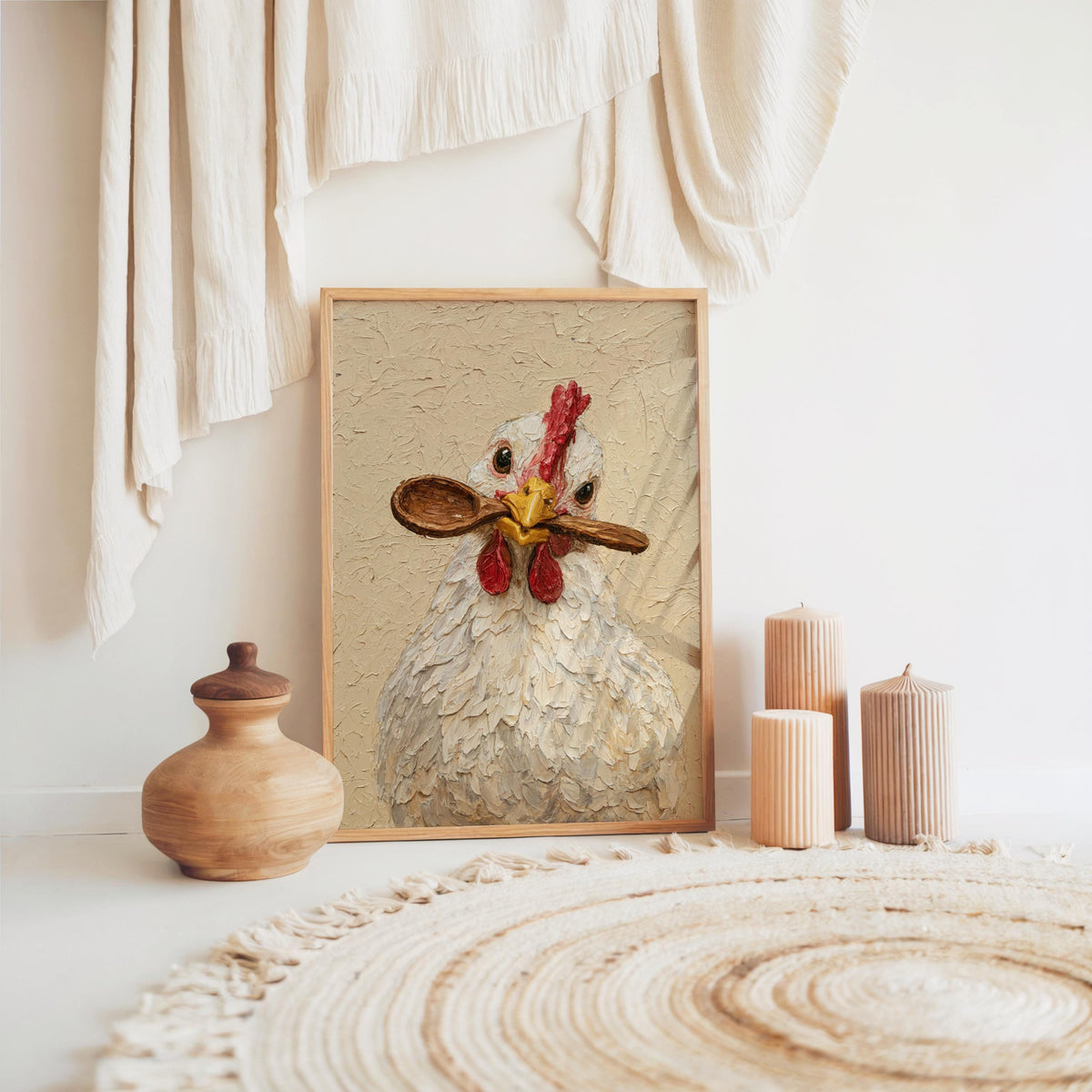 Boho vignette with framed hen holding spoon print on floor, woven rug and pottery, chicken kitchen wall art
