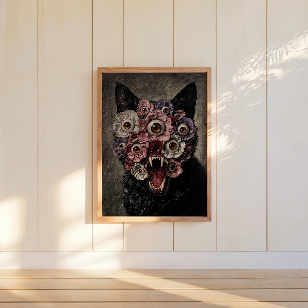 Dark fantasy wall art mounted low on paneled wall above a cream cabinet, the black cat floral wall art in soft morning light