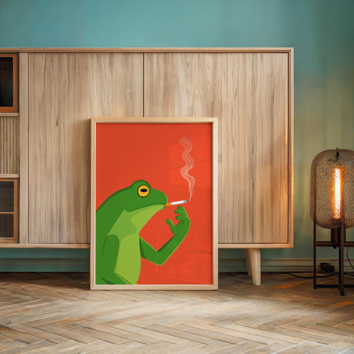 Retro orange funny frog wall art print leaning against mid-century cabinet, whimsical toad illustration
