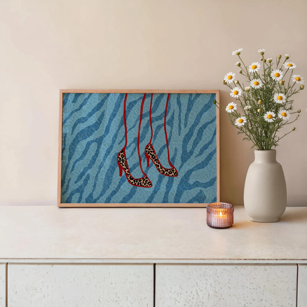 Blue zebra framed print on console with flowers and candle, maximalist fashion print vibe, stiletto heels poster, leopard heels wall art