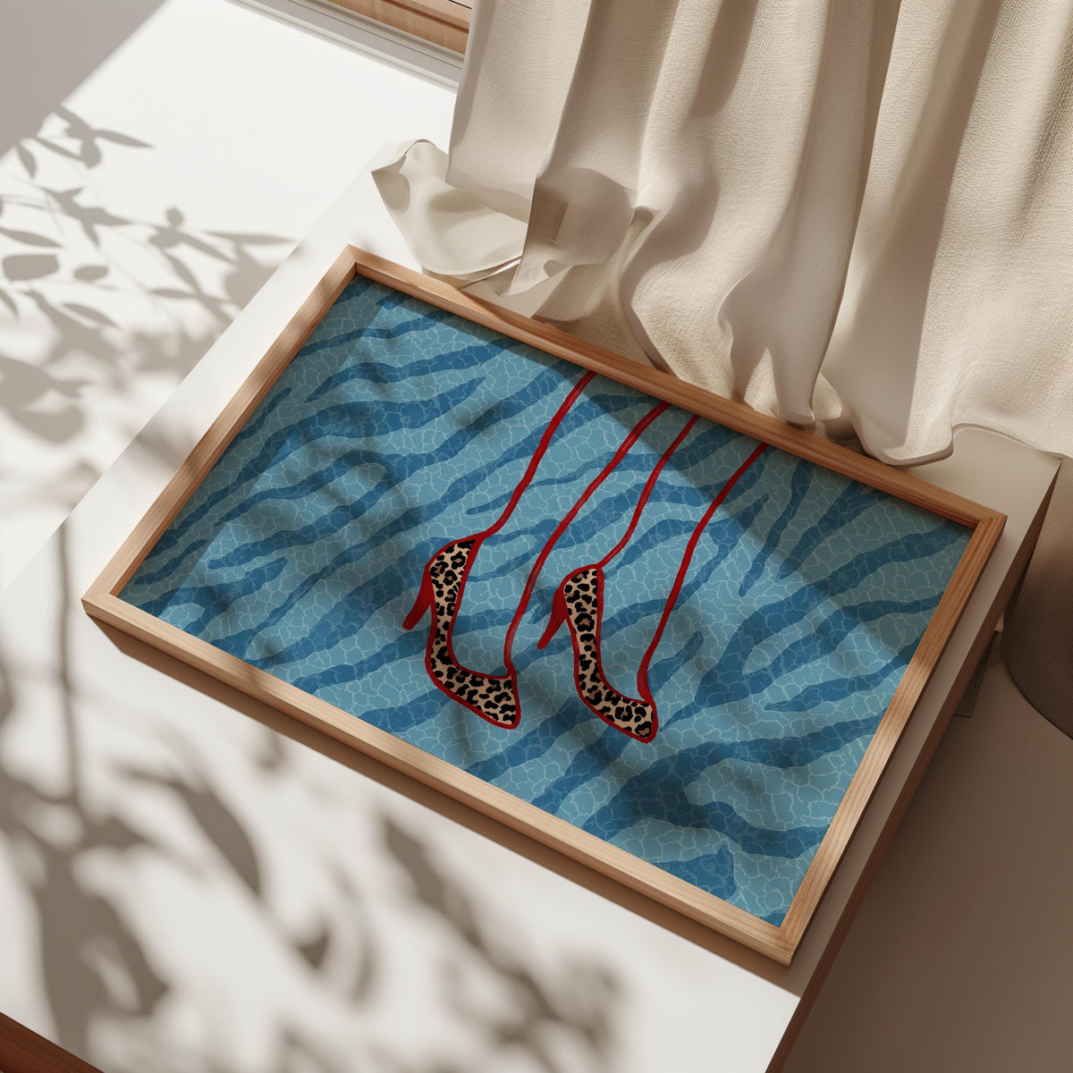 Saturated blue zebra framed on table, red-strap leopard stilettos hanging, fashion shoe wall art, leopard heels wall art