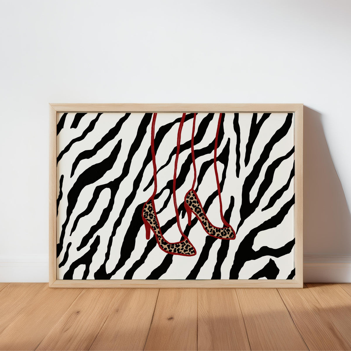 High-contrast black and white zebra backdrop in frame, red-strap leopard heels, animal print wall art, leopard heels wall art