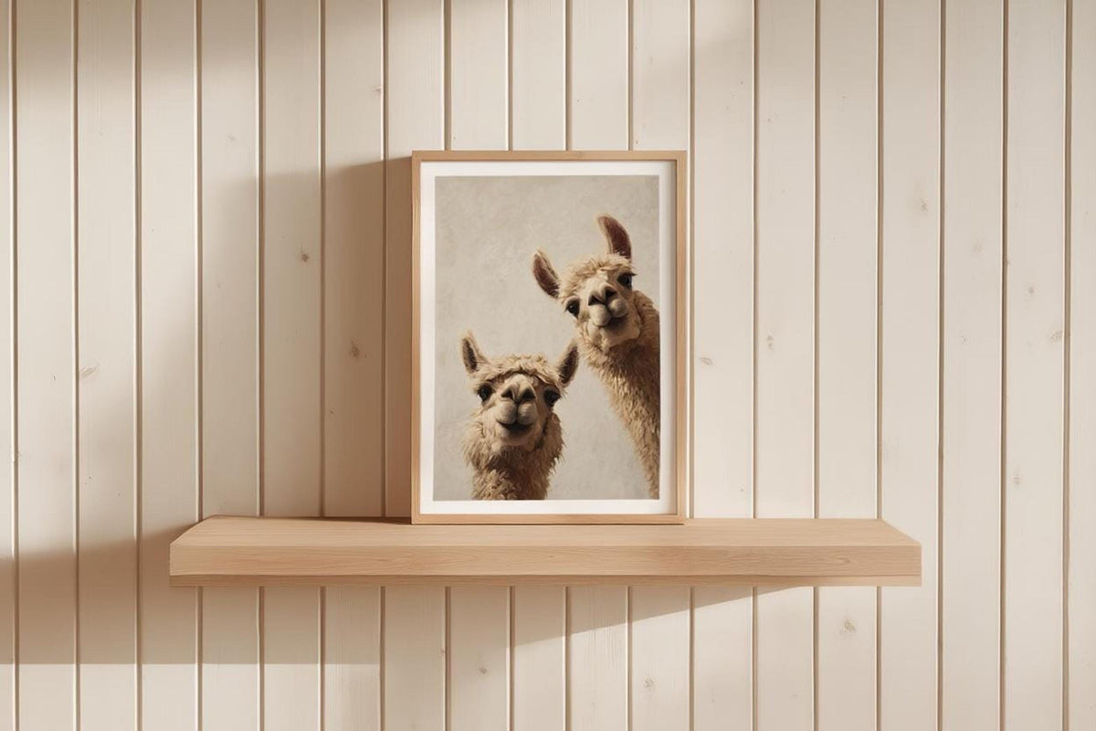 Framed llama print on a pale wood slatted wall shelf, clean modern nursery staging, llama nursery wall art digital download