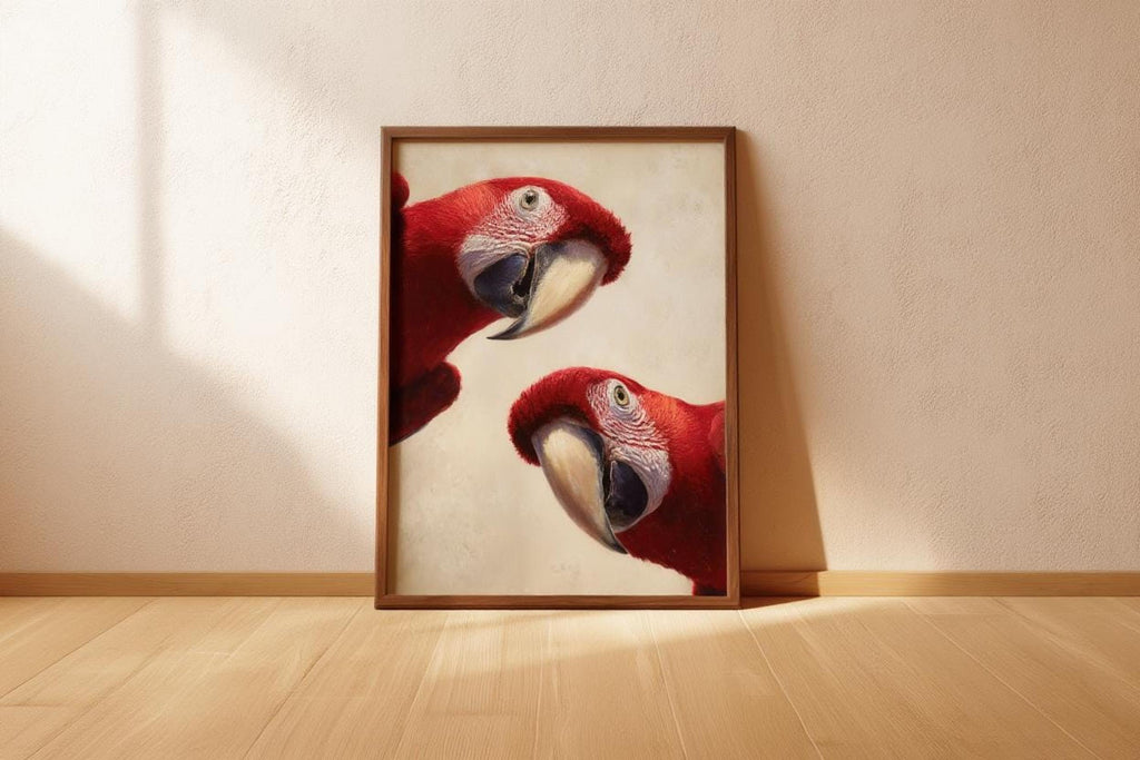 Scarlet macaw art print in a light frame resting on the floor, creamy textured background, bold whimsical red tones