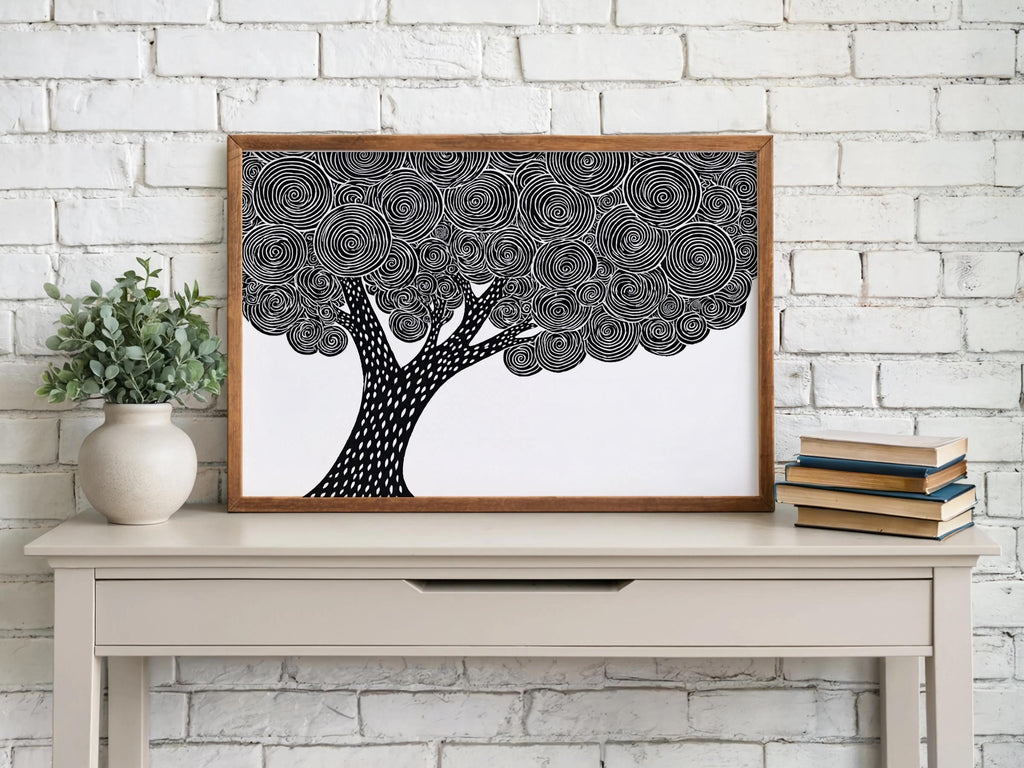 Black and white tree wall art above a white brick mantel, woodblock tree print, high contrast graphic