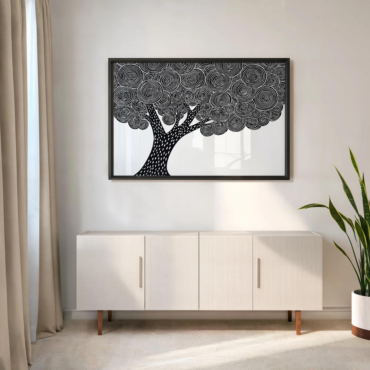 Black and white tree wall art centered over a low console, minimalist nature print with bold trunk