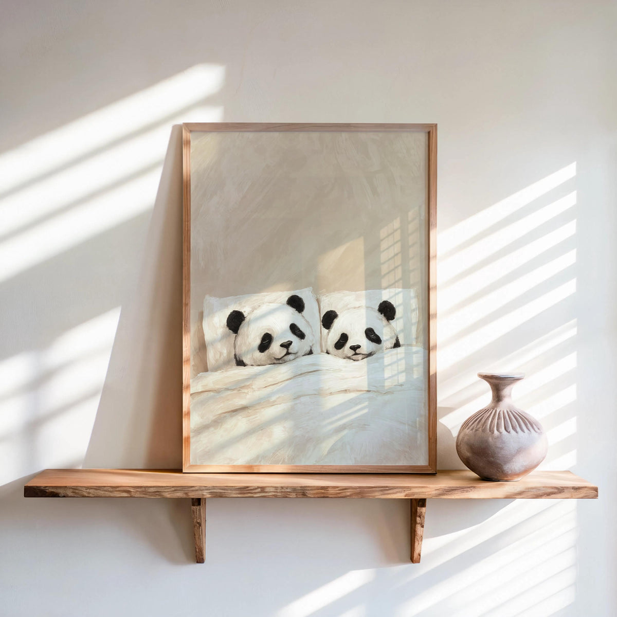 Cream sleeping panda wall art in a natural frame on a shelf, soft morning light, panda nursery wall art for cozy rooms