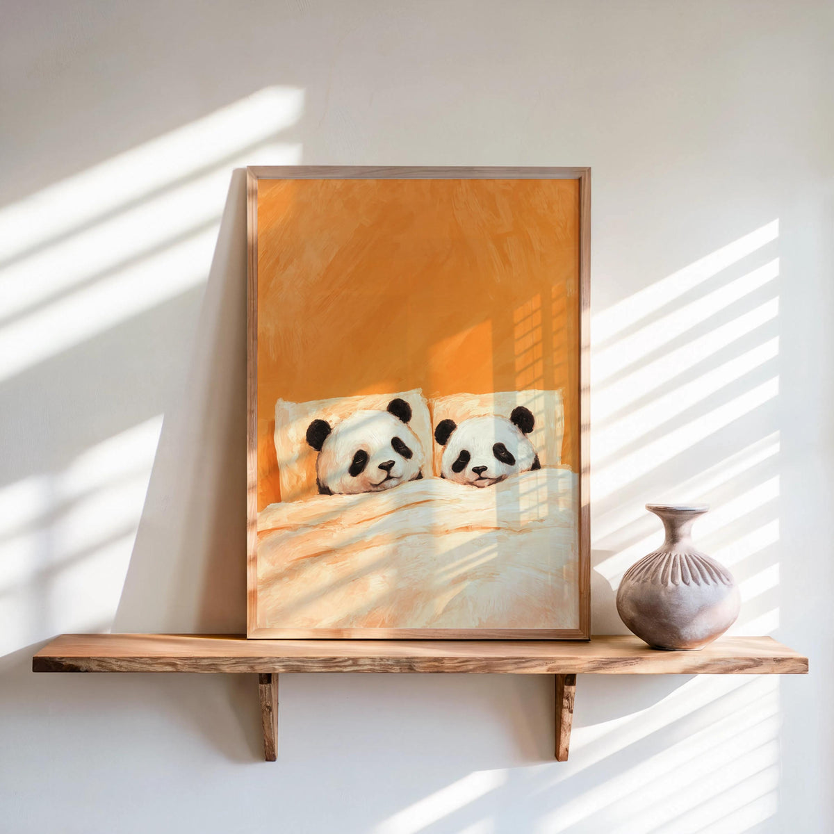 Orange sleeping panda wall art framed on a shelf, warm glow and shadows, romantic animal wall art with cuddling pandas