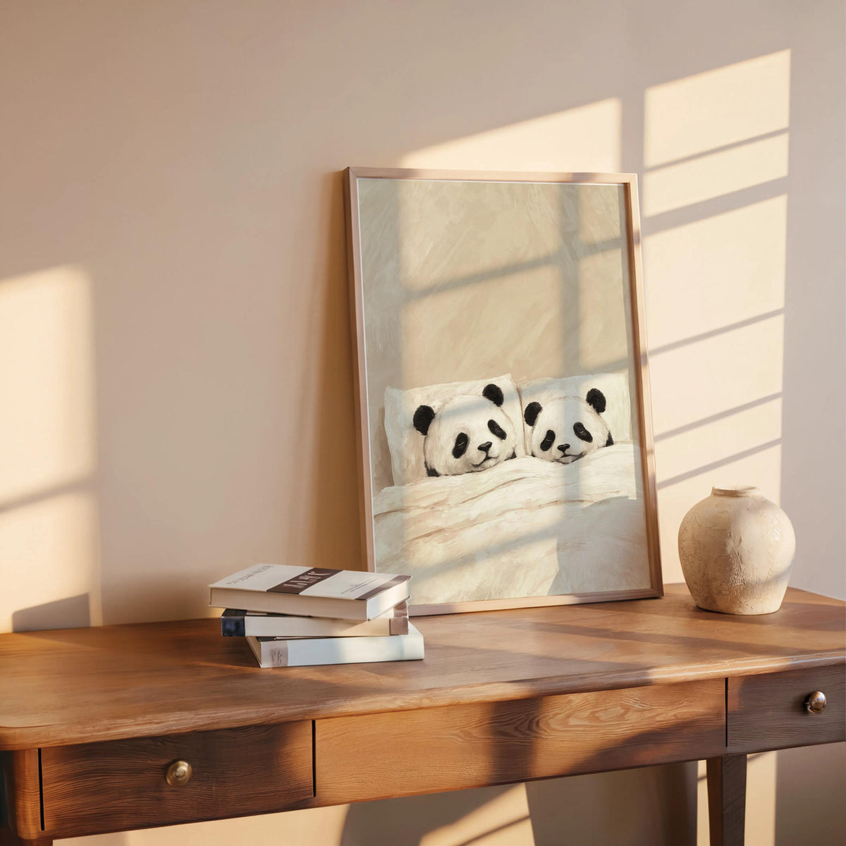 Cream sleeping panda wall art on a table with books, sunlit corner, panda bedroom decor and cozy nursery print
