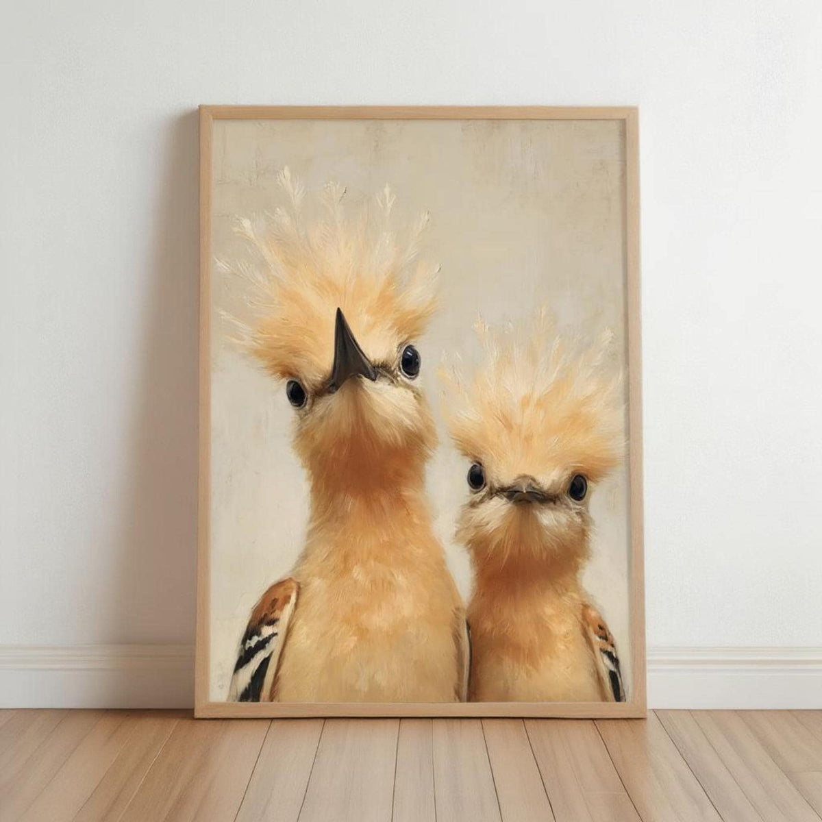 Framed whimsical bird nursery wall art, two peeking hoopoes with fluffy crests, light wood frame, beige textured background.
