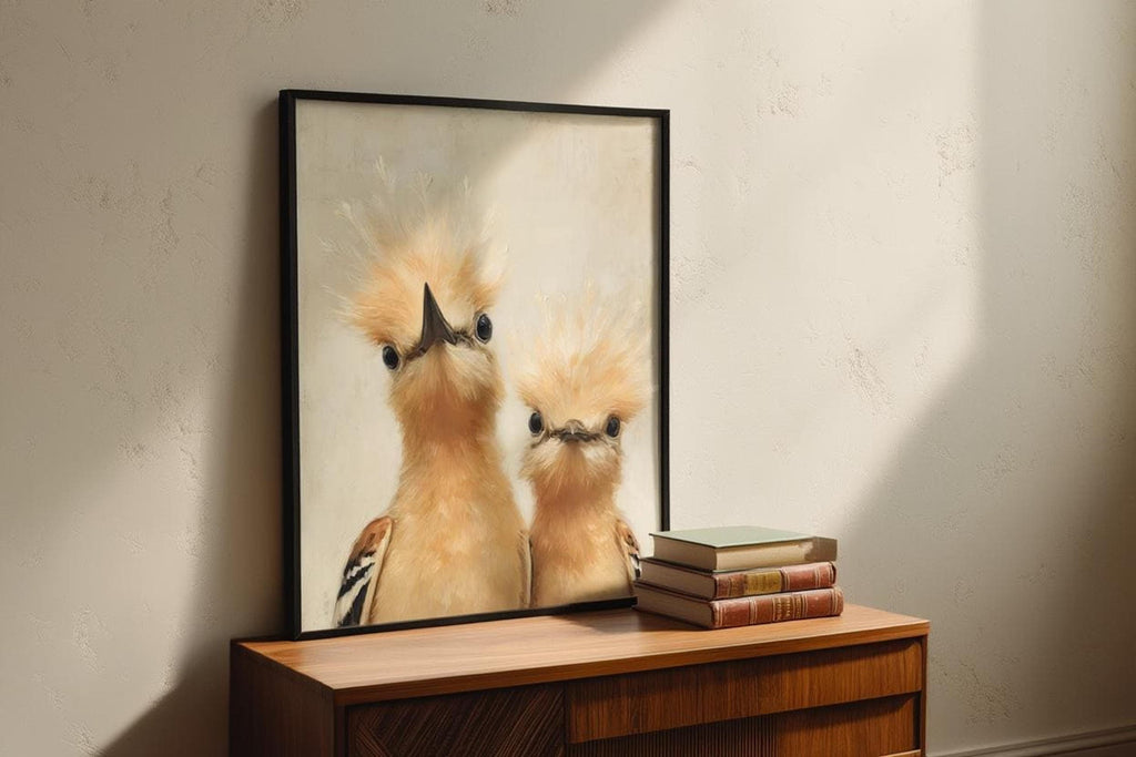 Whimsical bird nursery wall art leaning on a dresser, thin black frame, warm sunlight, playful hoopoes and painterly texture.