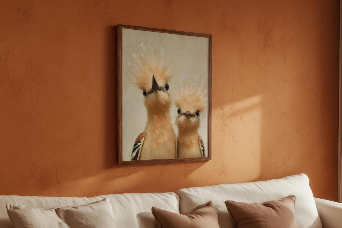 Whimsical bird nursery wall art hung over sofa on a terracotta wall, humorous peeking hoopoes, neutral nursery wall decor vibe.