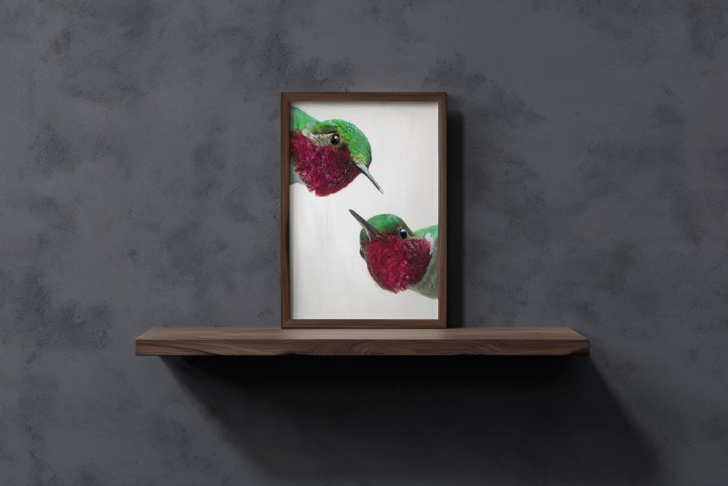 Minimal grey concrete backdrop, whimsical hummingbird wall art print on slim shelf, mid century modern bird art.
