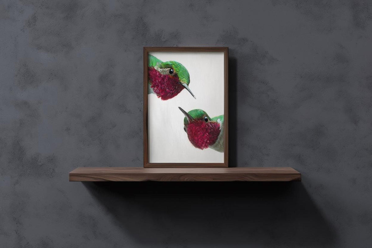 Minimal grey concrete backdrop, whimsical hummingbird wall art print on slim shelf, mid century modern bird art.
