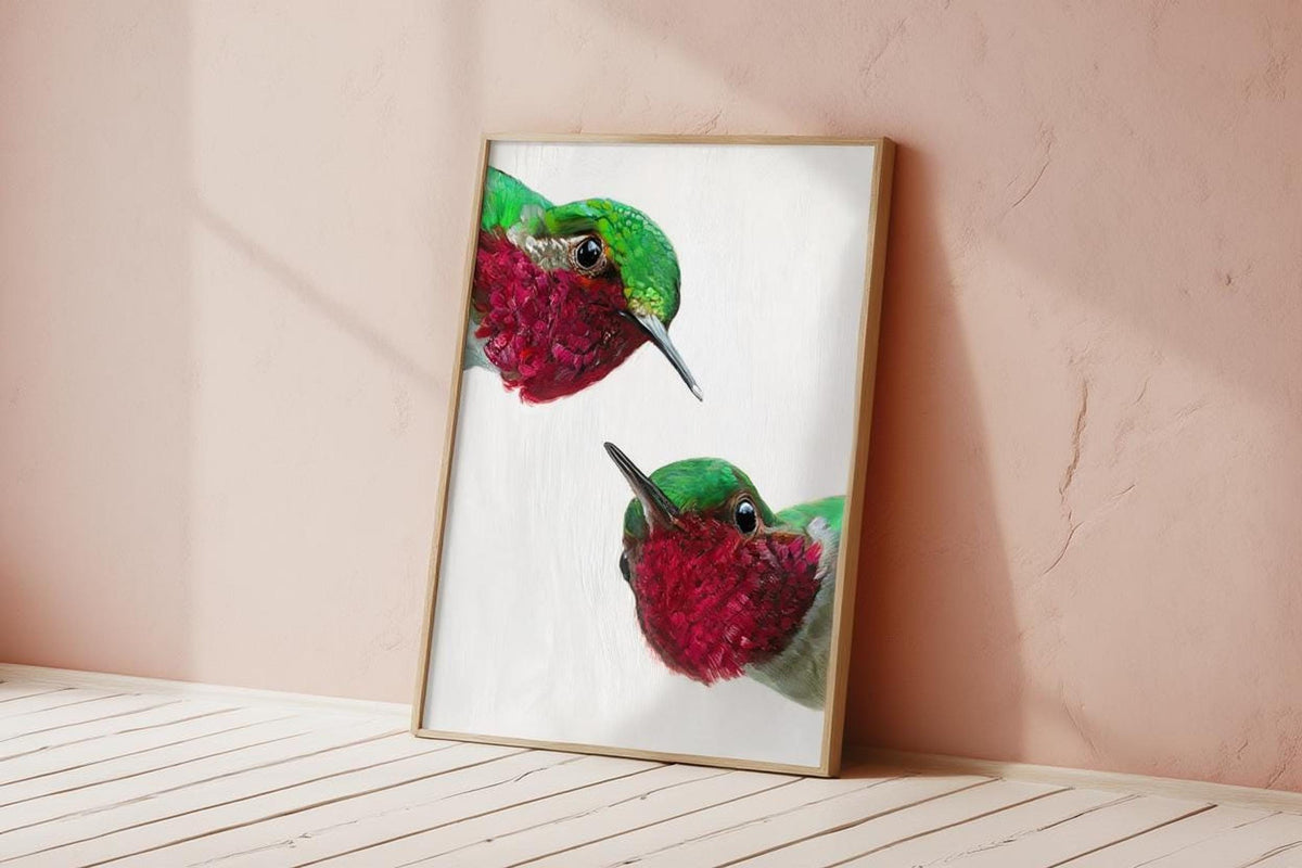 Blush wall and patterned floor, whimsical hummingbird wall art print leaning, quirky bird wall art for living room.