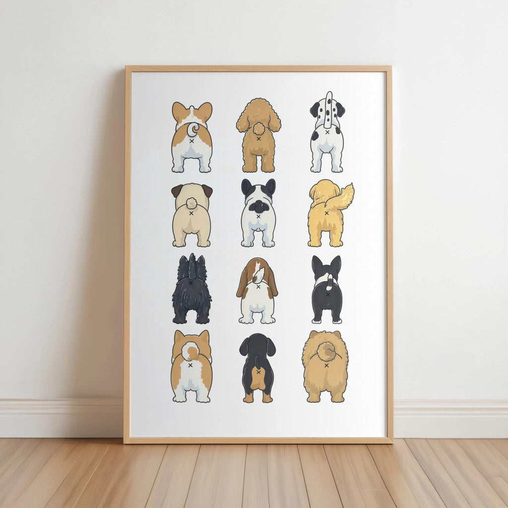 Framed funny dog butt bathroom art print leaning on light wood floor, corgi and pug bums