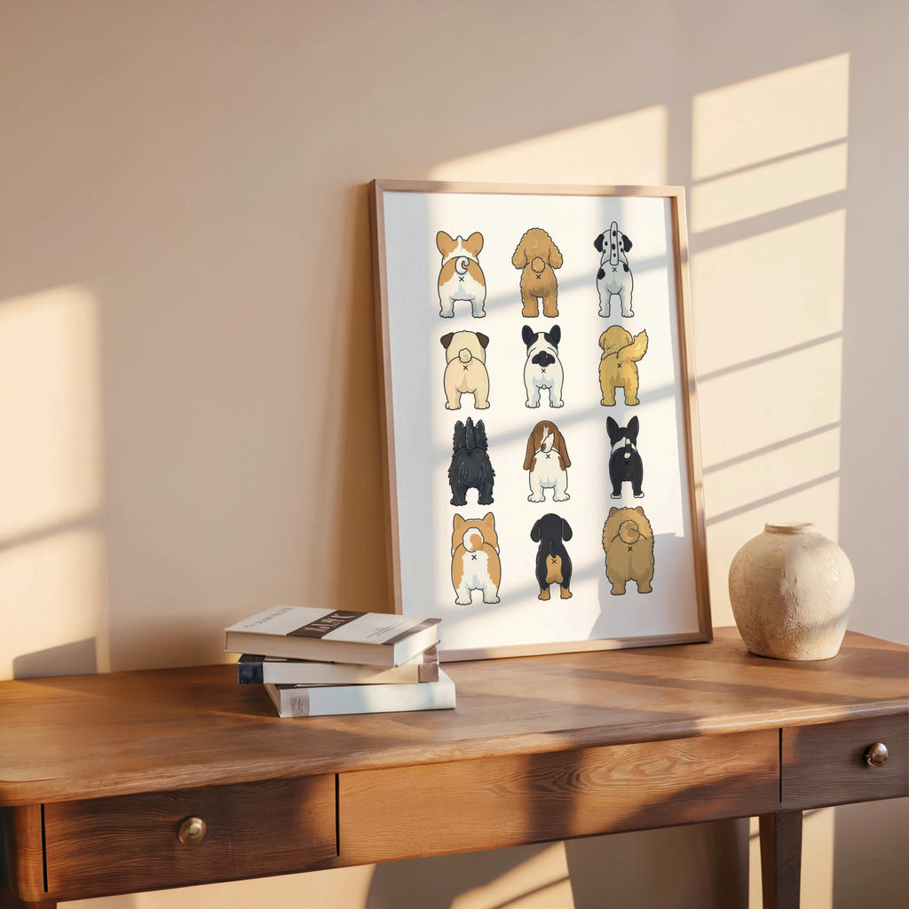 Print styled on wooden desk with books and ceramic orb, warm window light, funny dog butt bathroom art print