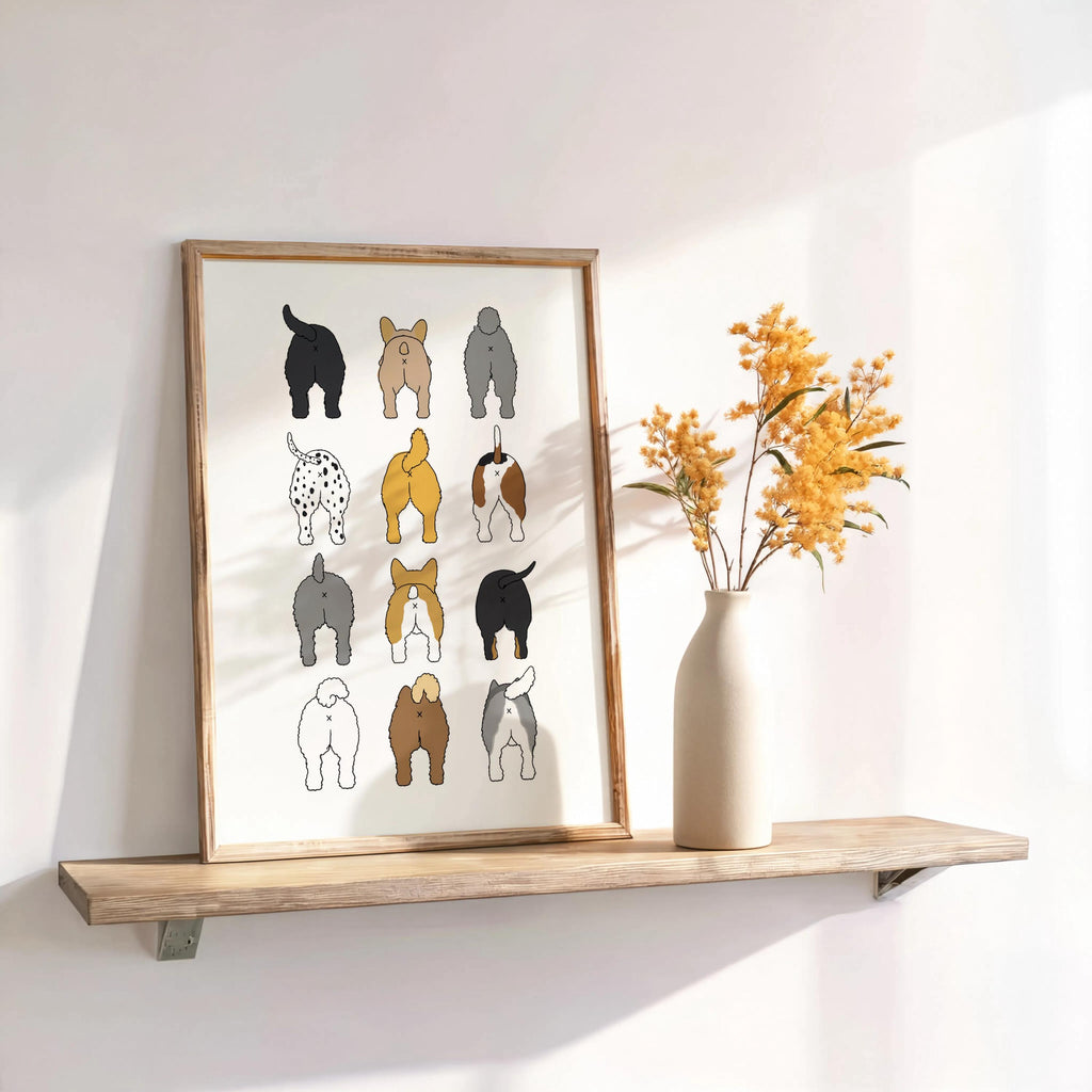Wood frame on a floating shelf with dried stems and soft light, charming quirky dog butt print ideal as a toilet art print