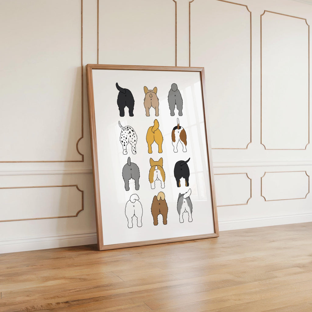 Oversized framed dog butt grid leaning against decorative wall paneling in an elegant foyer, humorous dog lover gift for bathroom
