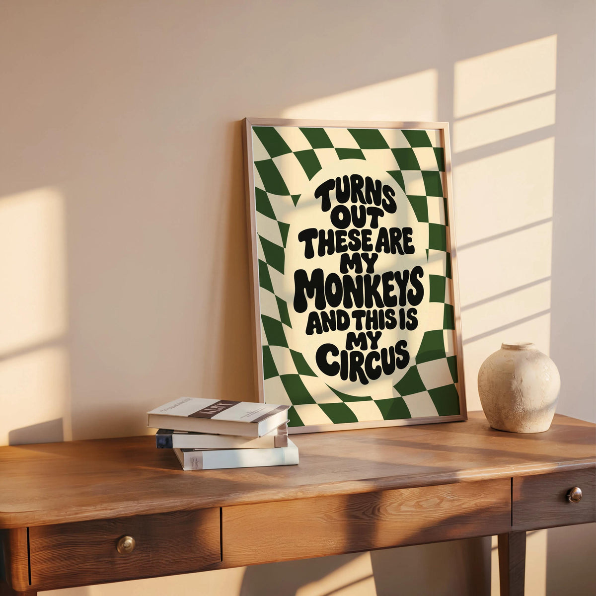 Green print resting on table near pottery, colorful retro wall art styling, not my circus not my monkeys wall art