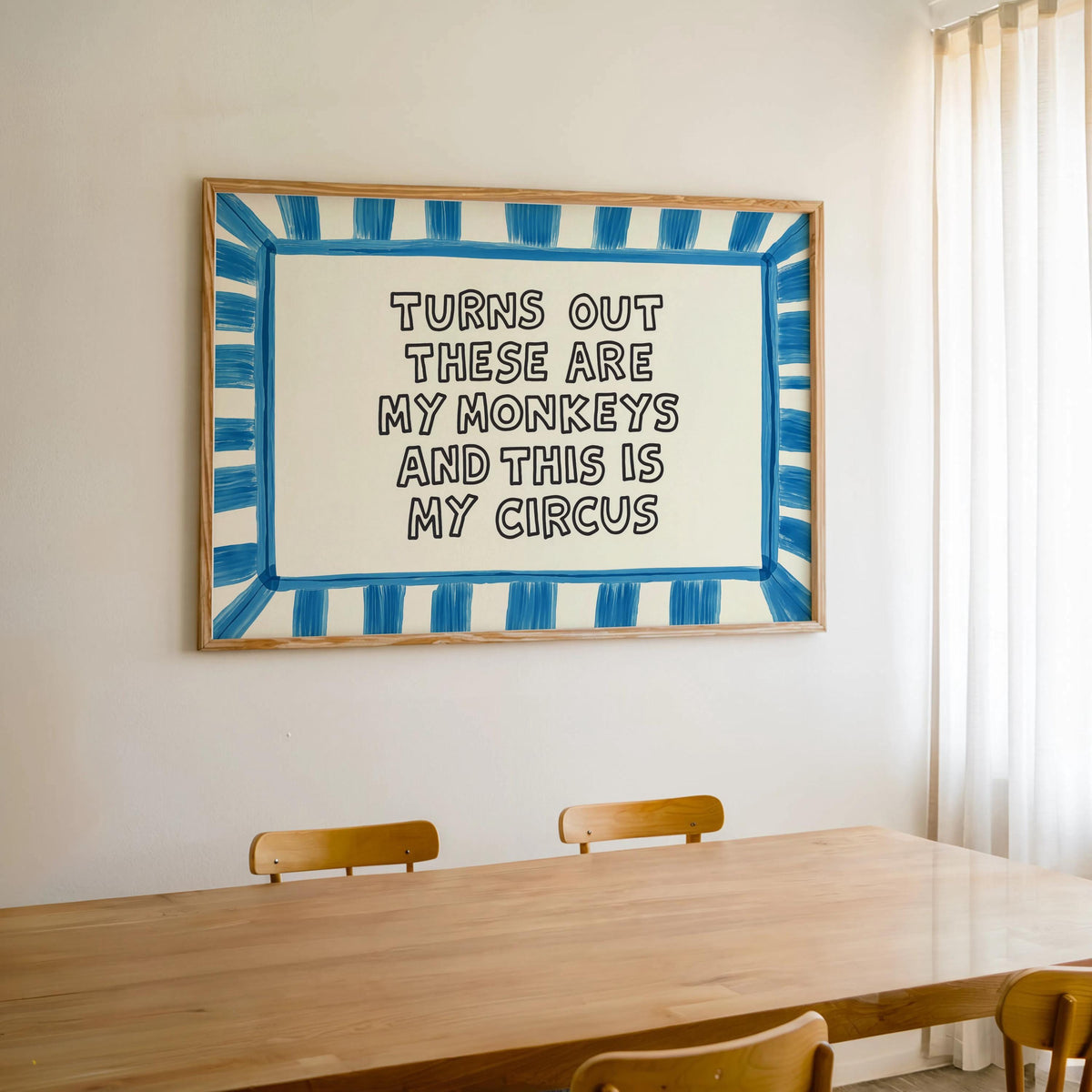 Blue striped framed print centered above table, retro-inspired colorful typography wall art, sarcastic family wall art, funny quote wall art.