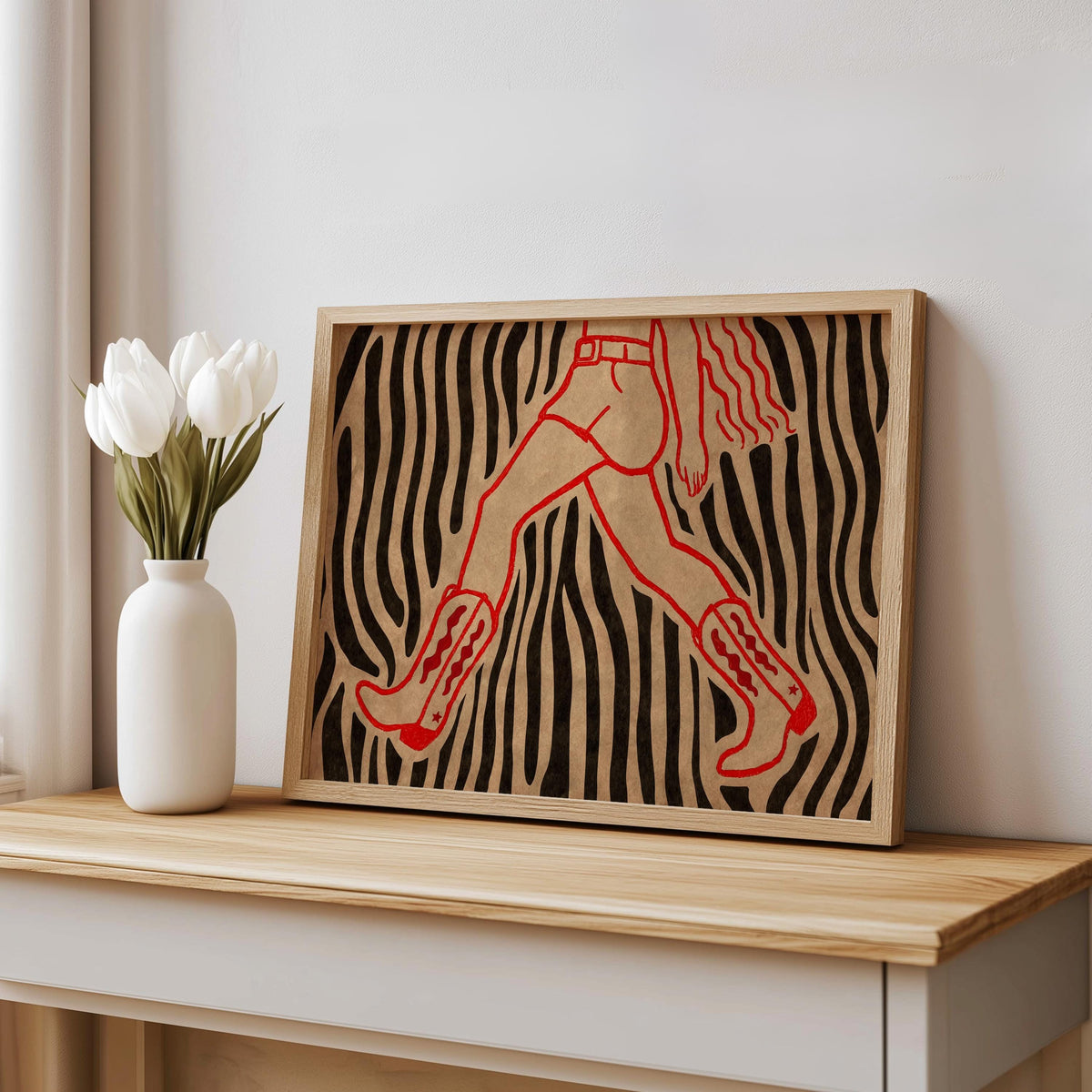 Zebra wall cowgirl wall art print propped on a shelf beside white vase, retro pop art cowgirl boots detail