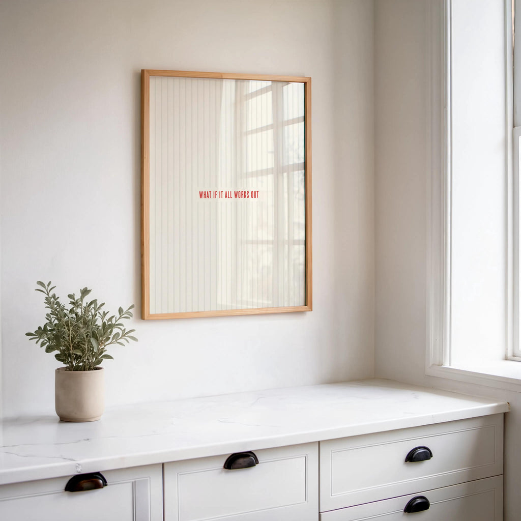 What if it all works out wall art reflected in a wall mirror above a white dresser, potted plant