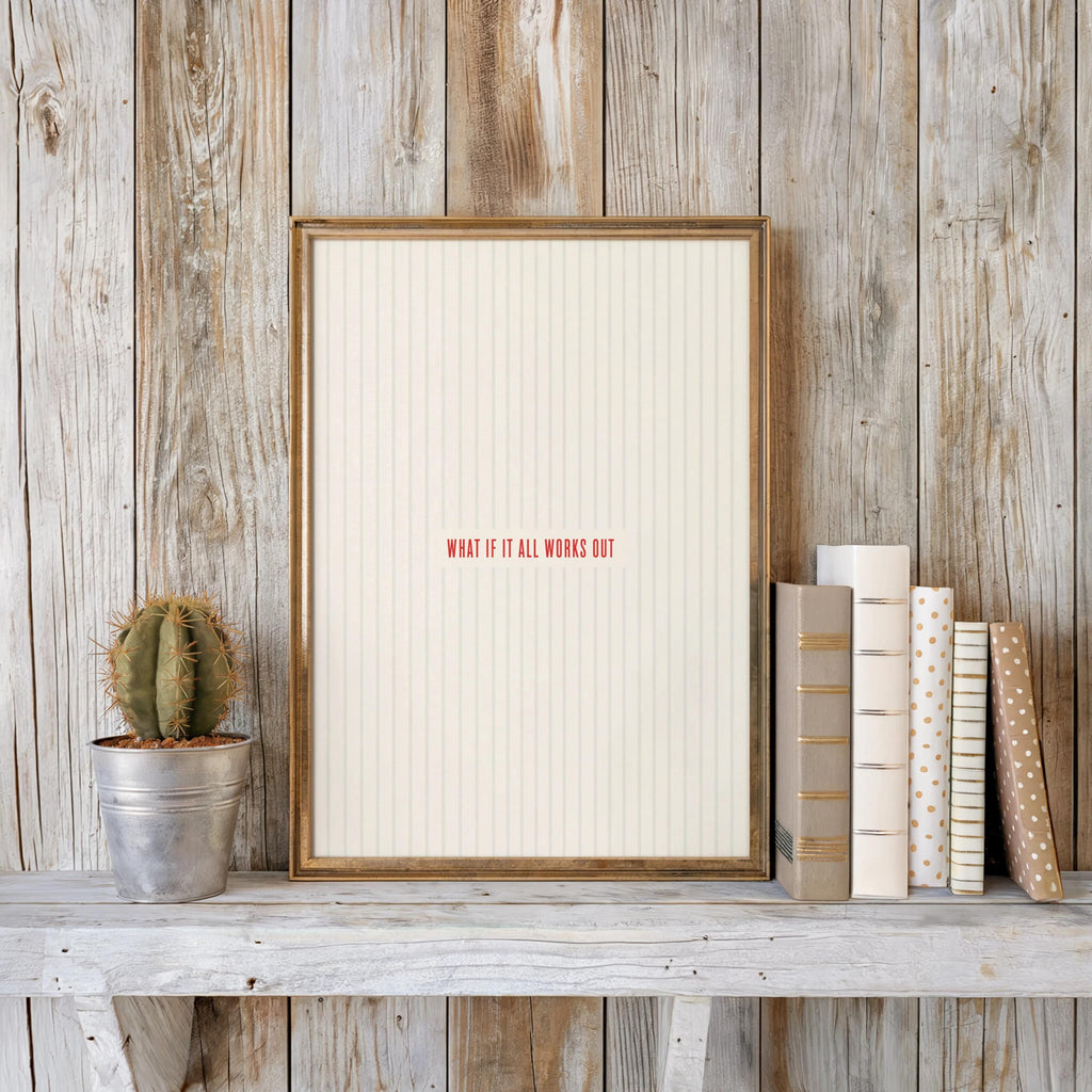 Rustic wood shelf with what if it all works out print, small cactus and stacked books nearby