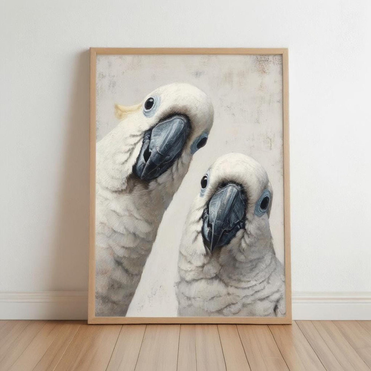 Framed funny cockatoo wall art print leaning on floor, two white cockatoos peeking, minimalist neutral decor