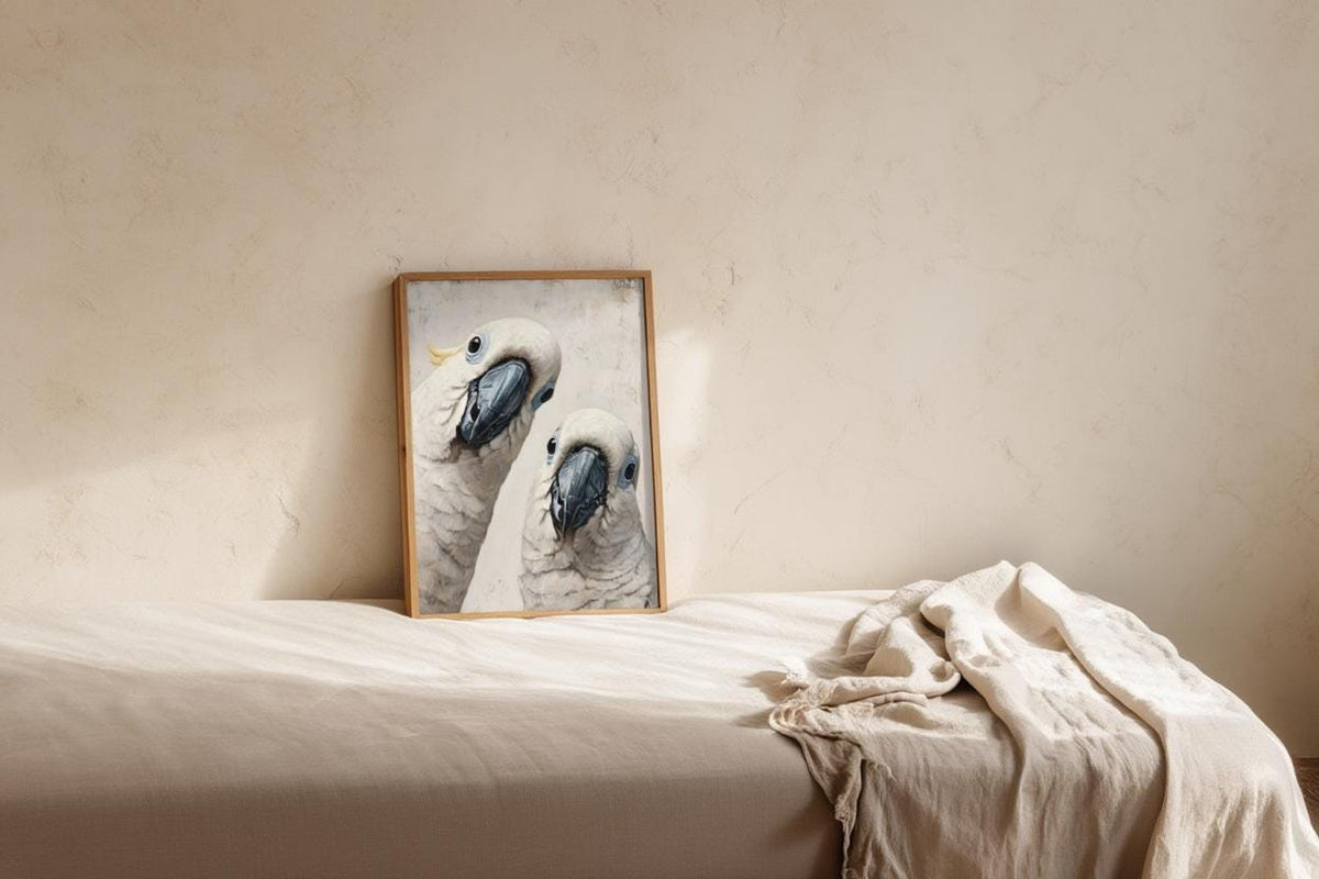 Small cockatoo poster print on a bedside ledge, whimsical animal nursery art with airy neutral tones