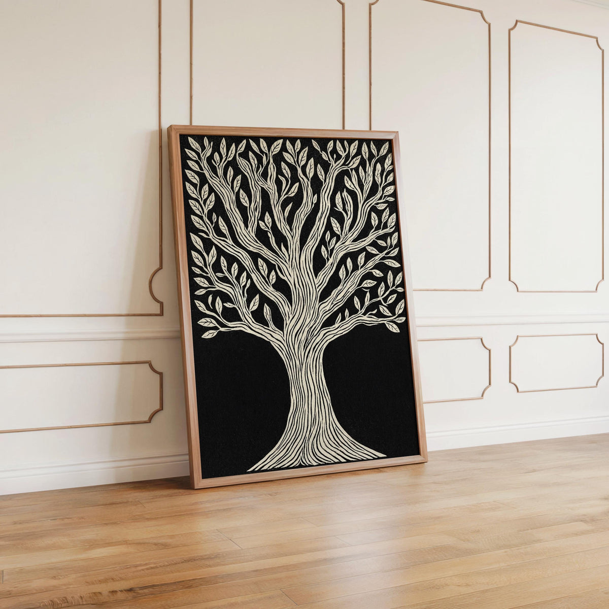 Tree of Life wall art leaning against pale paneled wall, warm wood frame, bold black and cream contrast.