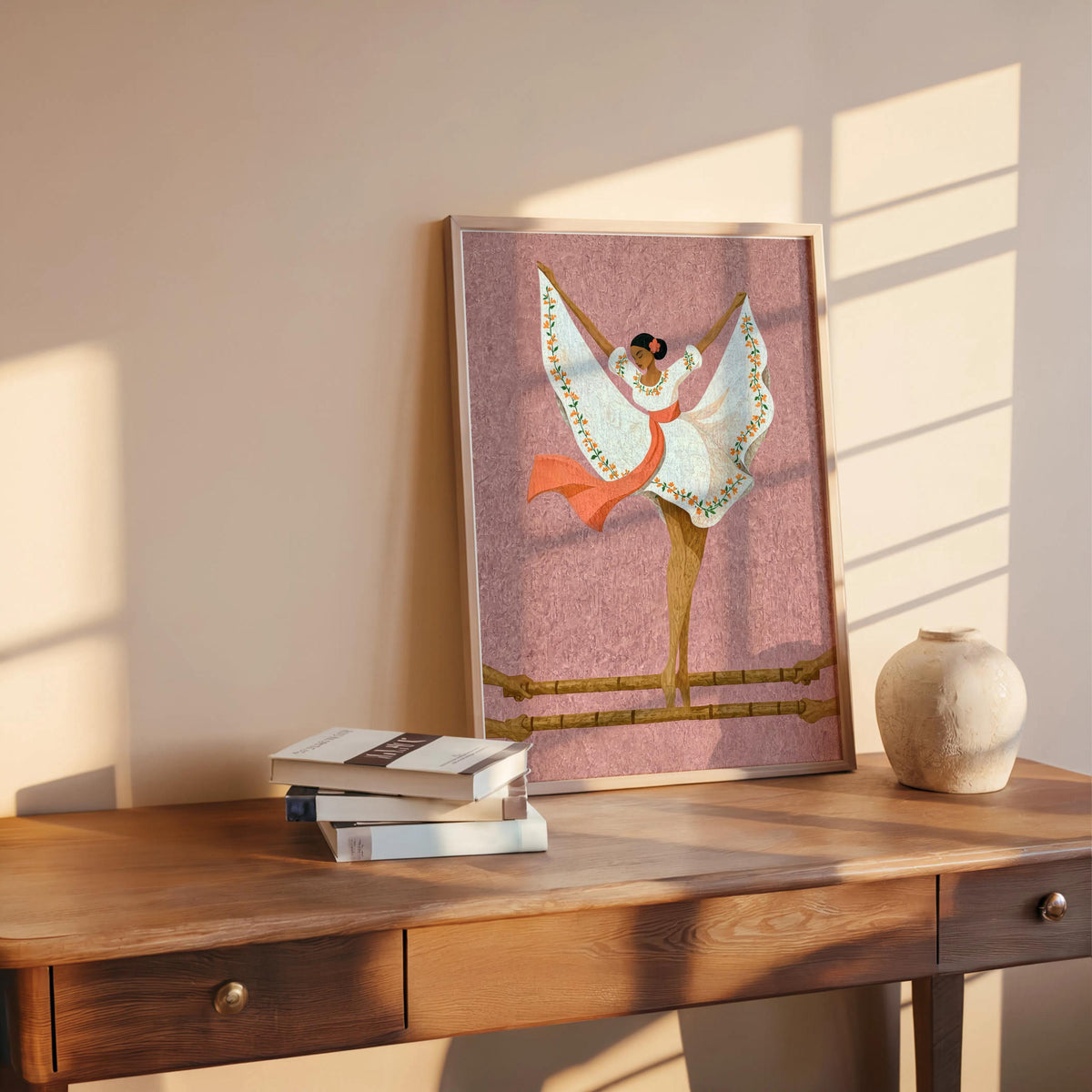 Dusty rose Filipino folk dance wall art on table, delicate floral embroidery on the dress visible, Pinoy wall decor styling