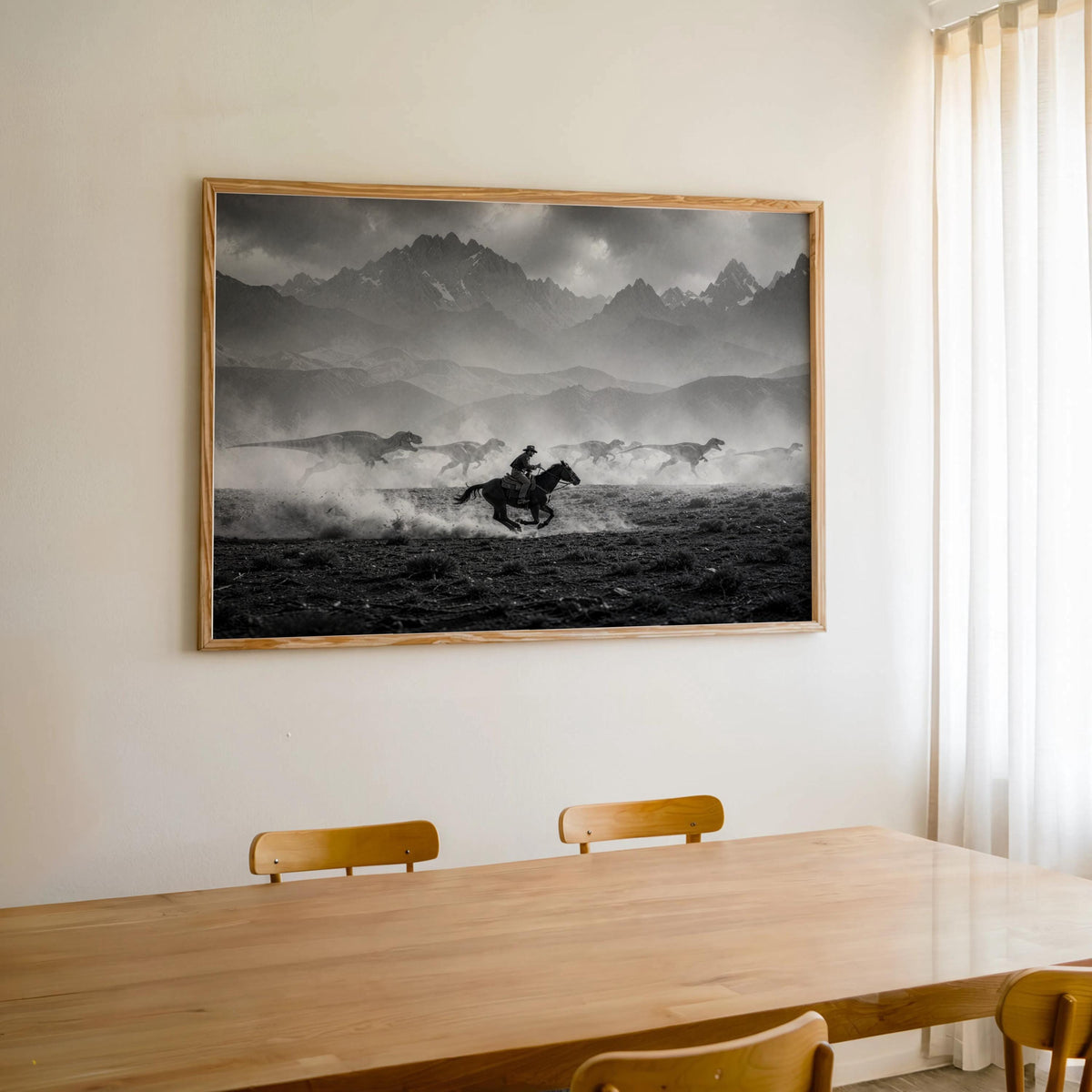 Large framed cowboy dinosaur wall art hung above dining table, dramatic mountains and lone rider
