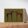 Framed horizontal surreal horse wall art leaning on white wall, olive green, muted earth tones