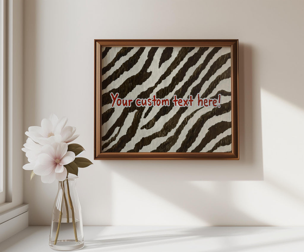 Small framed custom typography print above a ceramic vase, personalized zebra print wall art for subtle decor