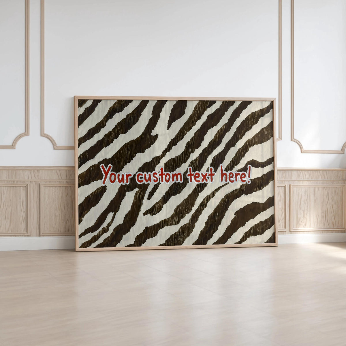 Large framed personalized zebra print wall art leaning against ornate molding, modern statement wall art look
