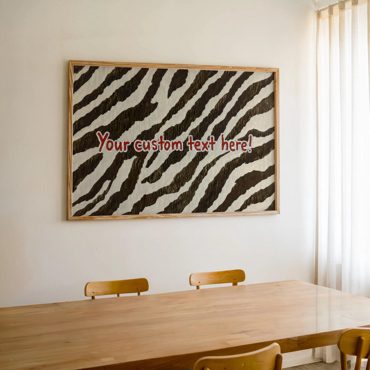 Framed zebra print home decor hung above a dining table, personalized zebra print wall art with feminine vibe