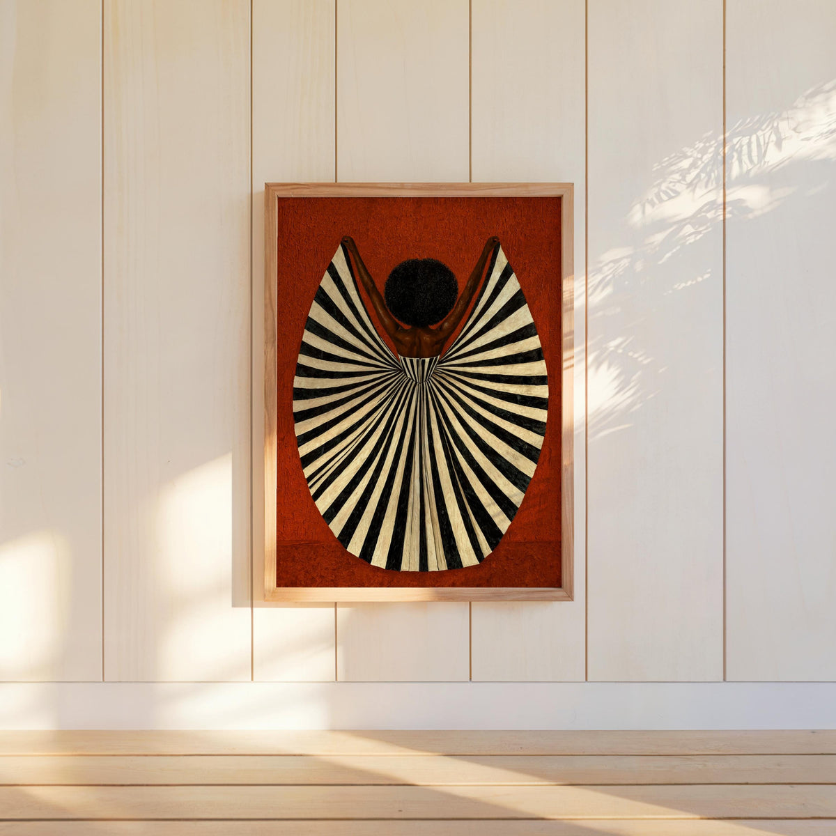 Small rust background print hung on white shiplap, high-contrast fan dress and afro, statement wall art, abstract black woman wall art