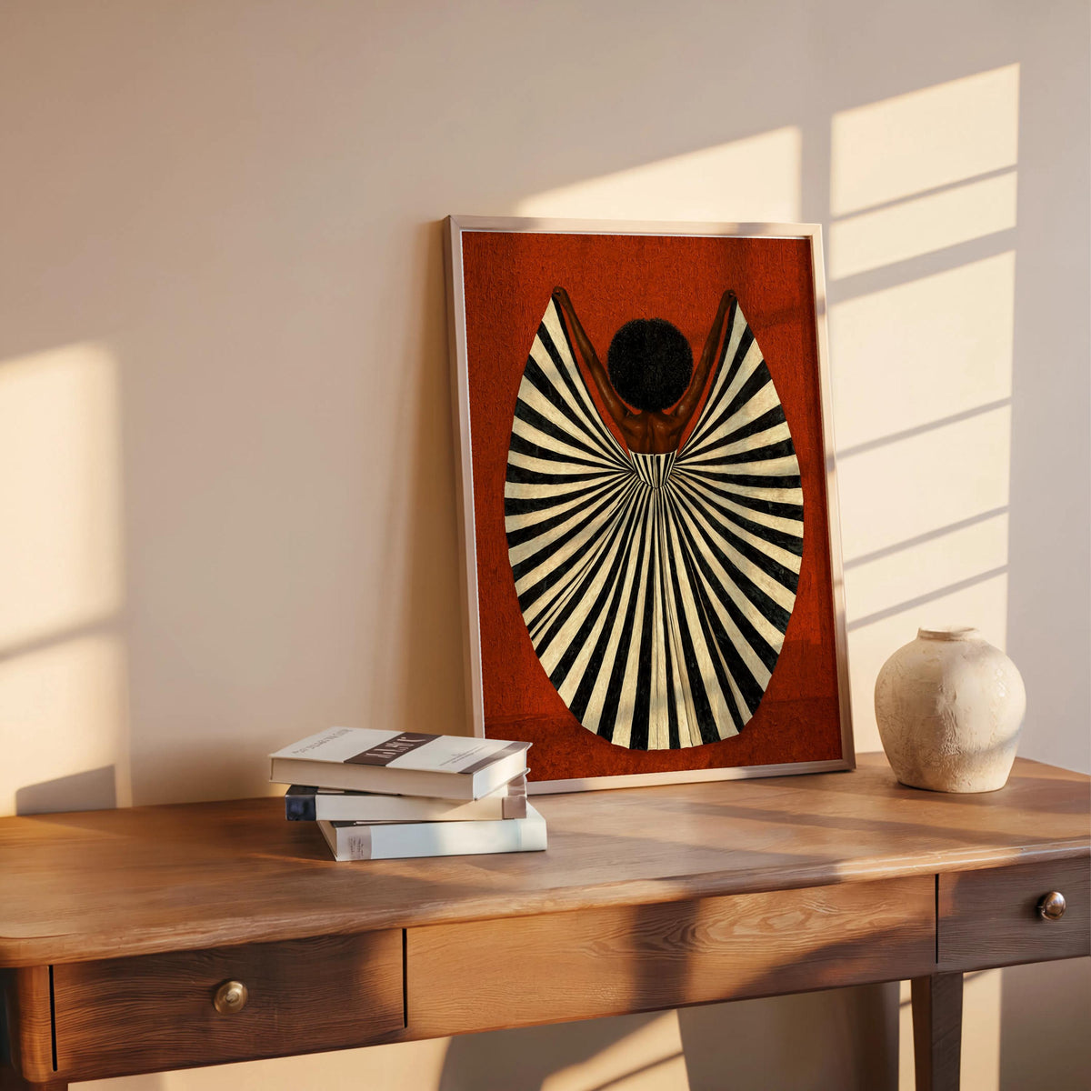 Rust orange print on shelf near vase and books, graphic vintage-inspired silhouette, woman in dress art print, abstract black woman wall art