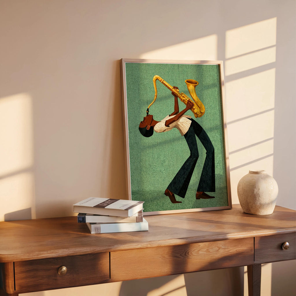 Afrocentric jazz wall art print propped on desk, green retro canvas, styled with books and a small vase.