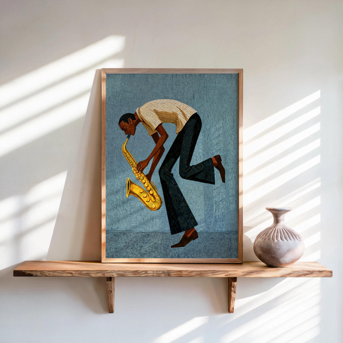 Framed blue mid century saxophone wall art on shelf, dynamic saxophonist pose, textured retro mid century music print