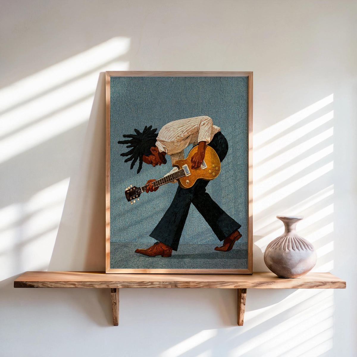 Framed print on shelf, blue backdrop, textured Afro hair, Black musician wall art, retro vibe