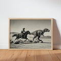Framed black and white dinosaur cowboy wall art leaning against white wall, wooden frame, dusty desert panorama