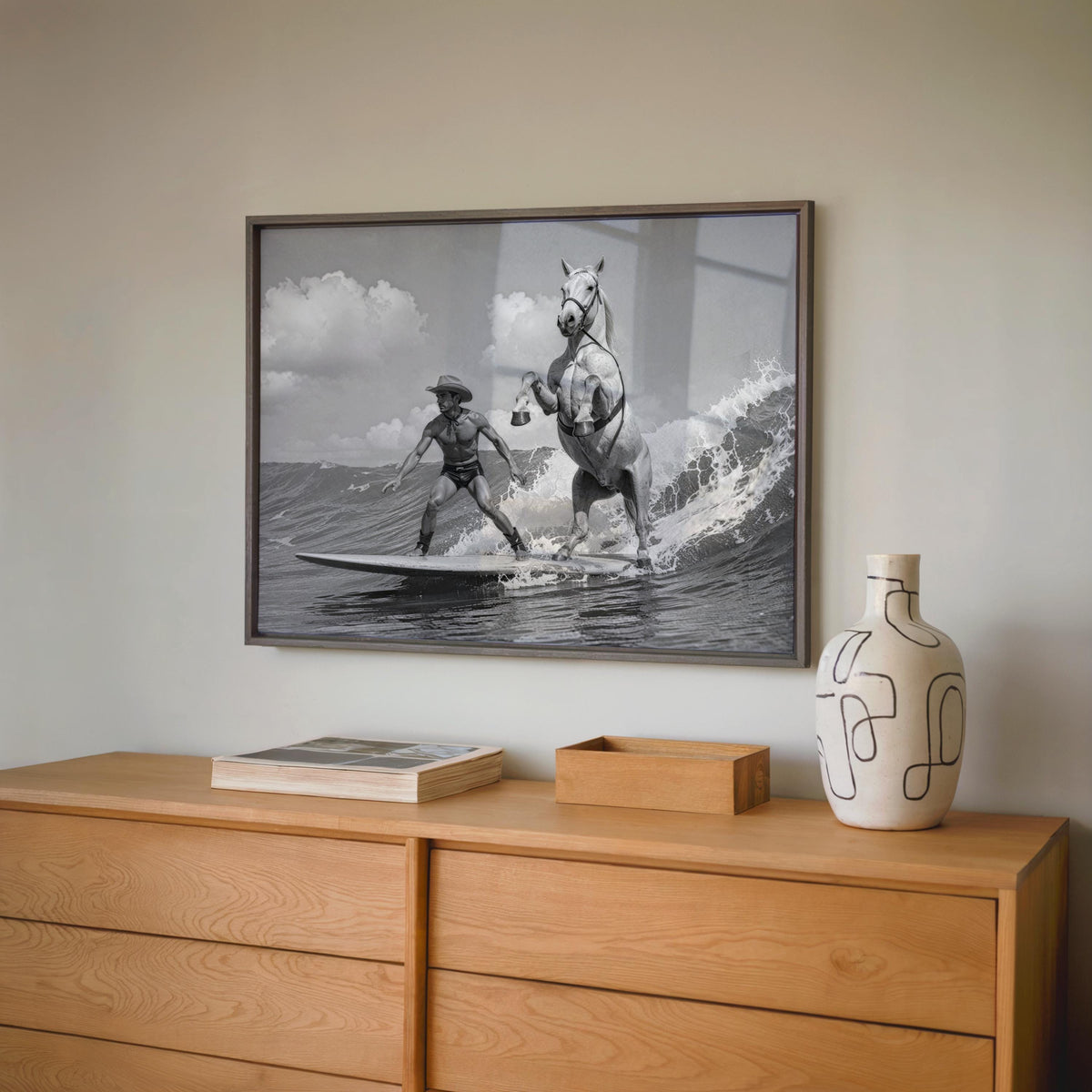 Large framed surreal equestrian art hung above wooden sideboard, horse surfing art scene