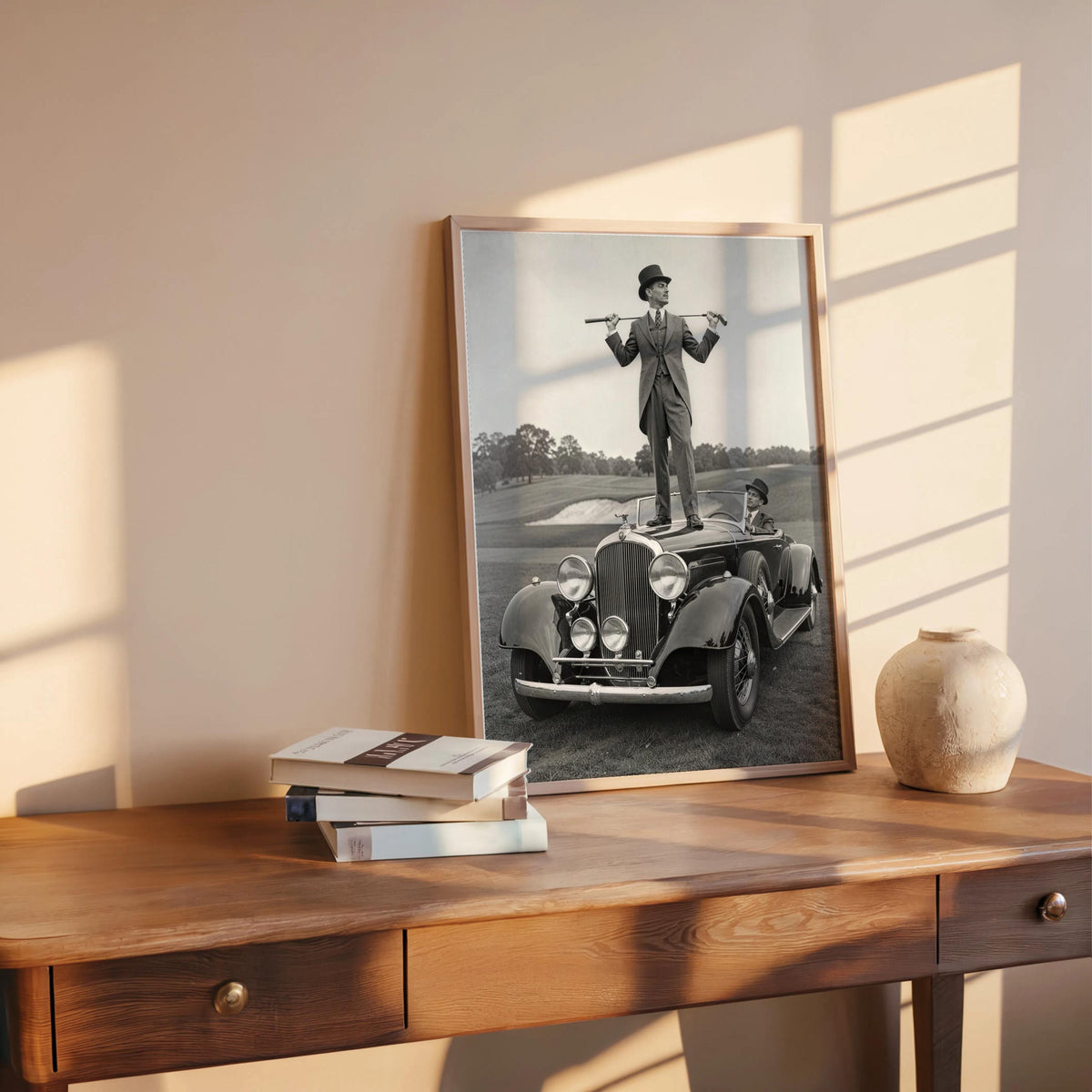 Retro golfer poster leaning on a rustic desk, sunlit, ceramic vase nearby, classic car wall art feel