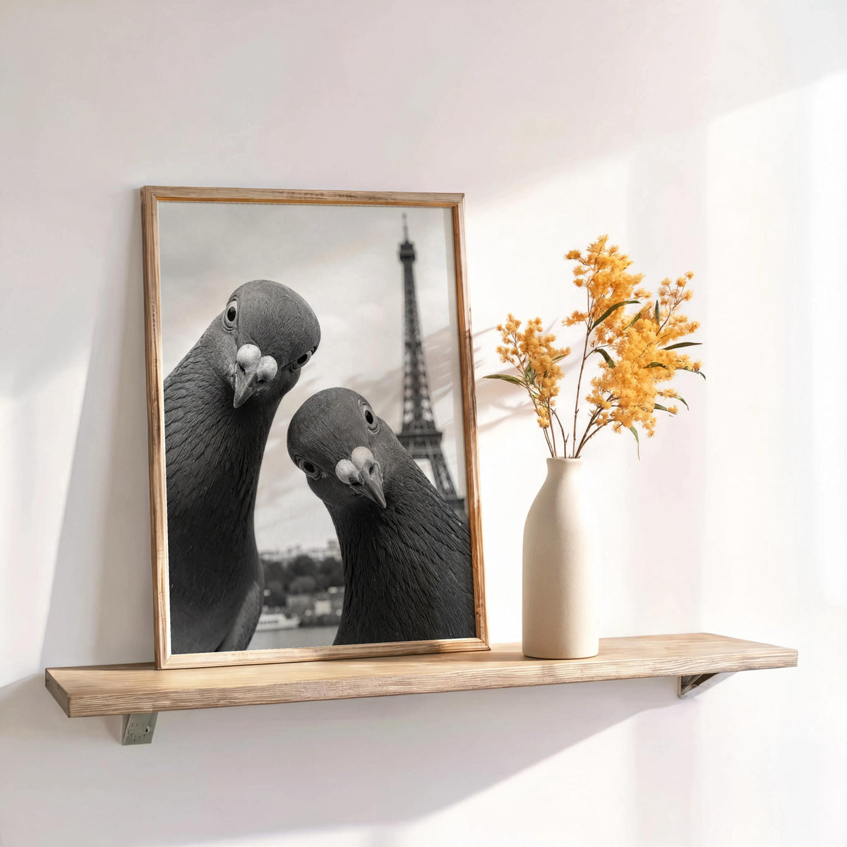 Narrow wall shelf holding framed black and white pigeon print and dried stems in vase, quirky Paris bird print, funny pigeon wall art