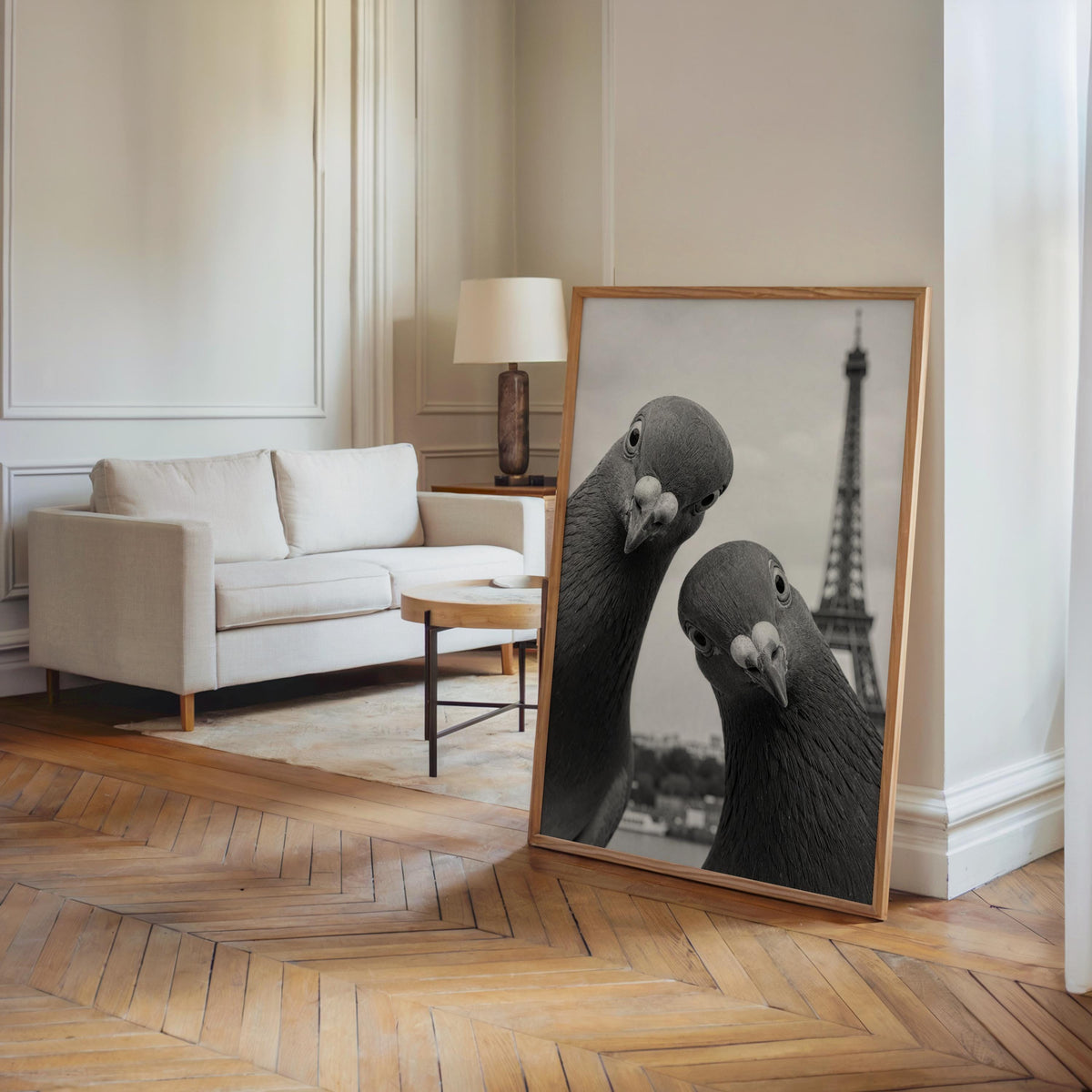 Large framed pigeon print propped in an airy living room corner, hardwood floors and tall baseboards, pigeon art print, funny pigeon wall art